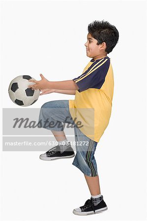 Boy playing with a soccer ball