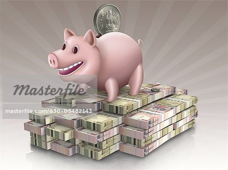 Piggy bank over stack of paper currency