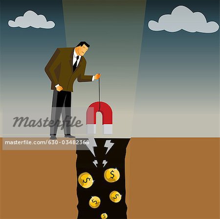 Businessman extracting money from a mine using a magnet