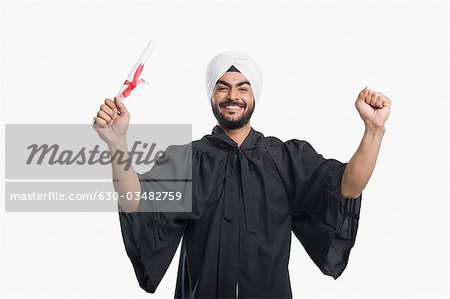 University student holding his graduation diploma
