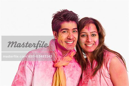 Portrait of a couple celebrating Holi
