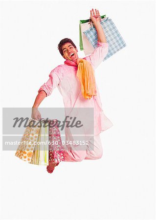 Man carrying shopping bags on Holi