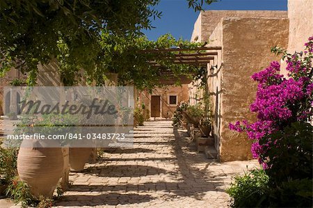 Terracotta urns and flowers in the cloister at Arkadhi Monastery (Moni Arkadhi), twenty-five miles from Rethymnon, Crete, Greek Islands, Greece, Europe