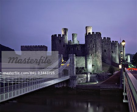 Telford Suspension Bridge at dusk, crossing the River Conwy, leading to Conwy Castle, UNESCO World Heritage Site, Gwynedd, North Wales, United Kingdom, Europe