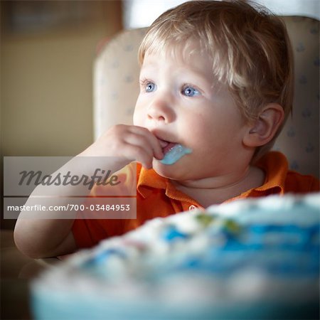 Toddler Eating Birthday Cake