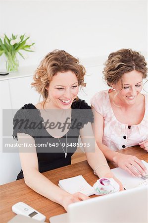 Two woman working together