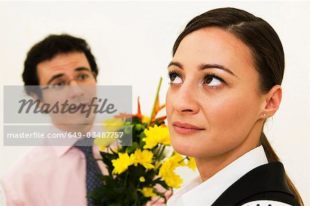 Women ignores man offering flowers