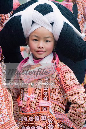 Long Horn Miao girl at lunar New Year festival celebrations in Sugao ethnic village, Guizhou Province, China, Asia