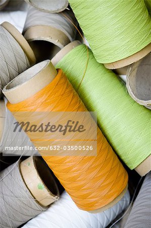 Département de fabrication textile composite recyclable d'usine, bobines de fil enduit excès