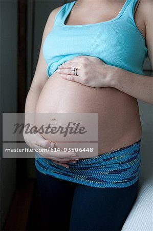 Woman showing pregnancy bump