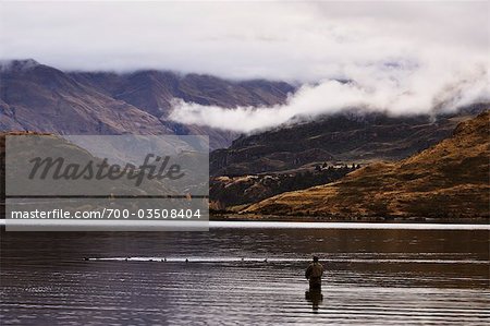 Angler at Lake Wanaka, Otago, South Island, New Zealand