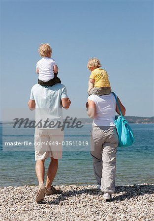 Family with twins at the beach