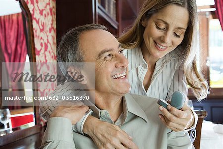 Mature couple, woman admiring new ring