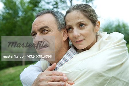 Mature couple embracing, portrait