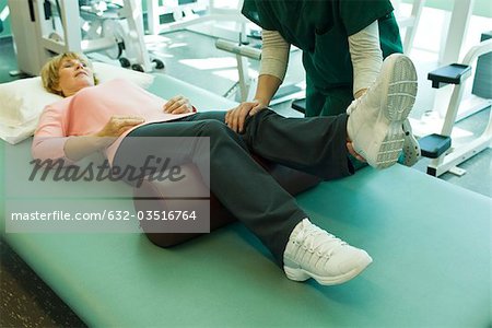 Woman being treated by physical therapist