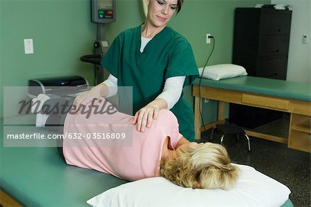 Woman being treated by physical therapist