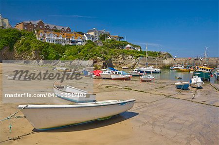 Small fishing boats and yachts at low tide, Newquay harbour, Newquay, Cornwall, England, United Kingdom, Europe