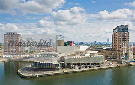 View across the Lowry Centre, apartments and new building construction work at Salford Quays Pier 8, Greater Manchester, England, United Kingdom, Europe