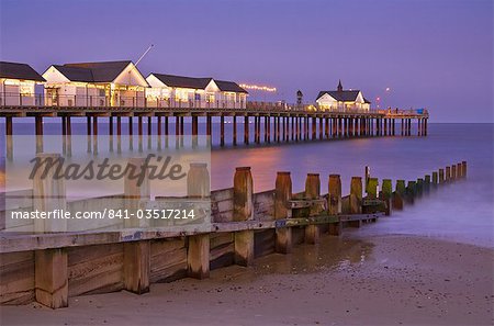 Southwold pier and wooden groyne at sunset, Southwold, Suffolk, England, United Kingdom, Europe