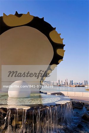 Pearl Momument on the Corniche of Doha Bay with the central business district of the West Bay on the horizon, Doha, Qatar, Middle East