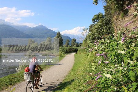 Family riding bicycle in Colico, Lake Como, Italian Lakes, Lombardy, Italy, Europe