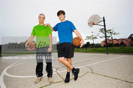 Father and Son on Basketball Court