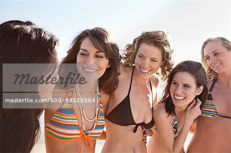 Young Women Standing on Beach, Zuma Beach, California, USA