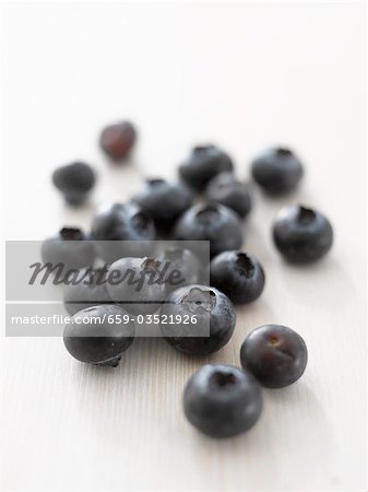 Blueberries on white wooden surface