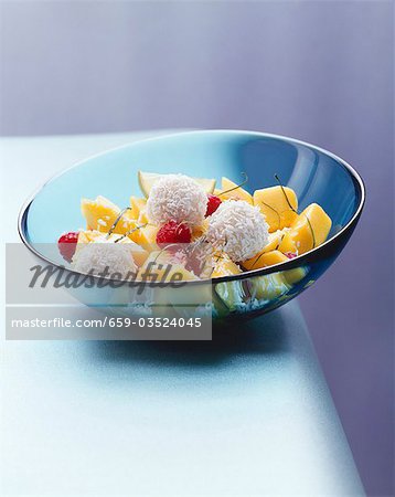 Mango salad with raspberries and coconut balls