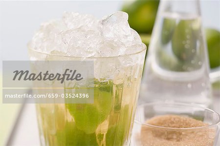 Caipirinha with lime and cane sugar Caipirinha with lime and cane sugar