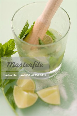Making Mojito with lime and mint Making Mojito with lime and mint