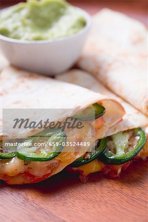 Tortillas with chilli and cheese filling, guacamole