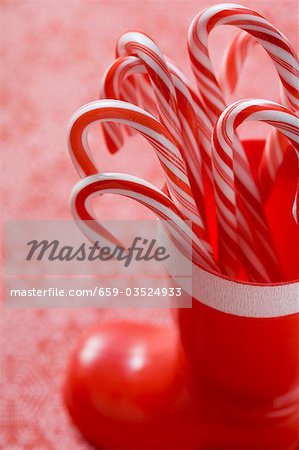 Candy canes in red plastic boot