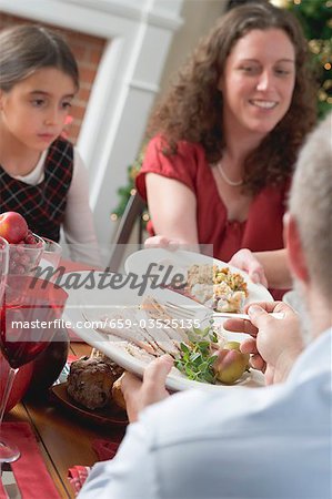 Family eating Christmas dinner (USA)