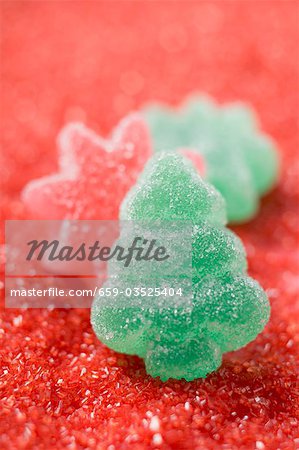 Jelly sweets on red sugar
