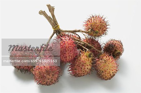 Several rambutans, tied in a bunch