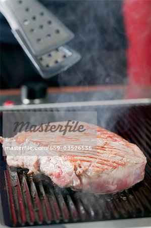 Grilling beef steak