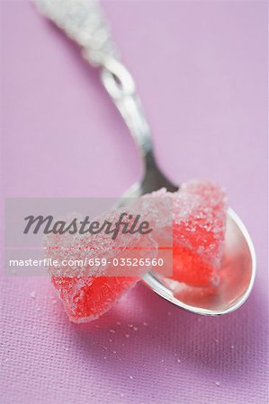 Two jelly hearts on silver spoon