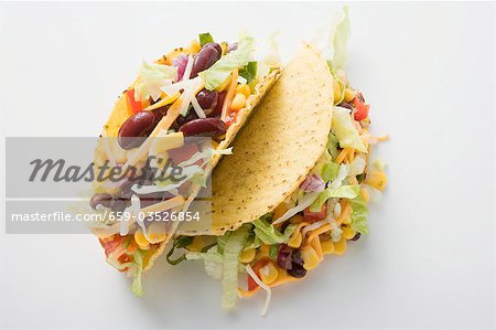 Two tacos filled with sweetcorn and beans