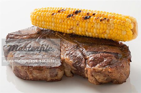 Grilled beef steak with corn on the cob