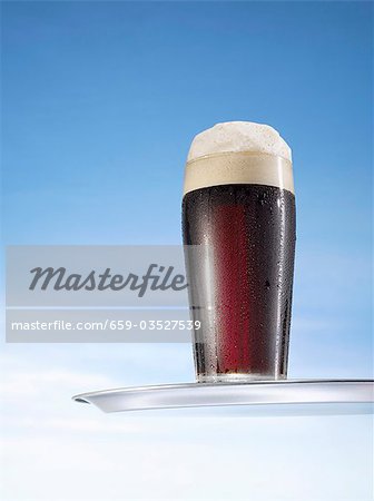 Guinness in glass on tray