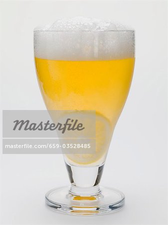 Glass of shandy with slice of lemon (UK) Glass of shandy with slice of lemon (UK)