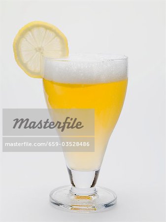 Glass of shandy with slice of lemon (UK) Glass of shandy with slice of lemon (UK)