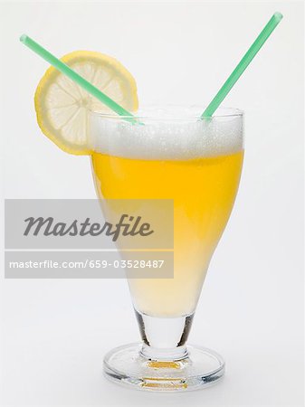 Glass of shandy with slice of lemon and straws (UK) Glass of shandy with slice of lemon and straws (UK)