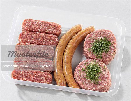 Cevapcici, sausages and burgers in plastic container