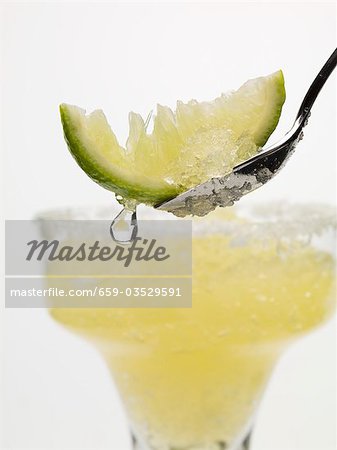 Frozen Margarita, lime wedge on spoon