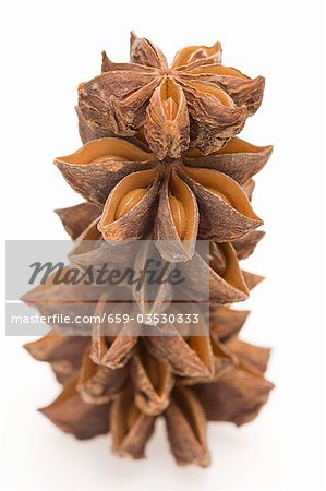 Several star anise, stacked