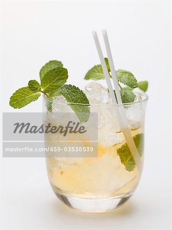 Mojito with mint, ice cubes and straws Mojito with mint, ice cubes and straws