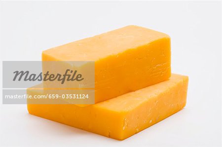 Two pieces of Cheddar cheese