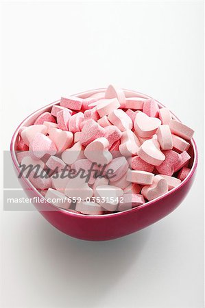 Pink glucose hearts in a bowl